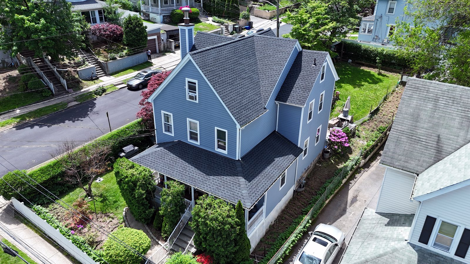 High-end exterior renovation with a new roof by E.M Construction