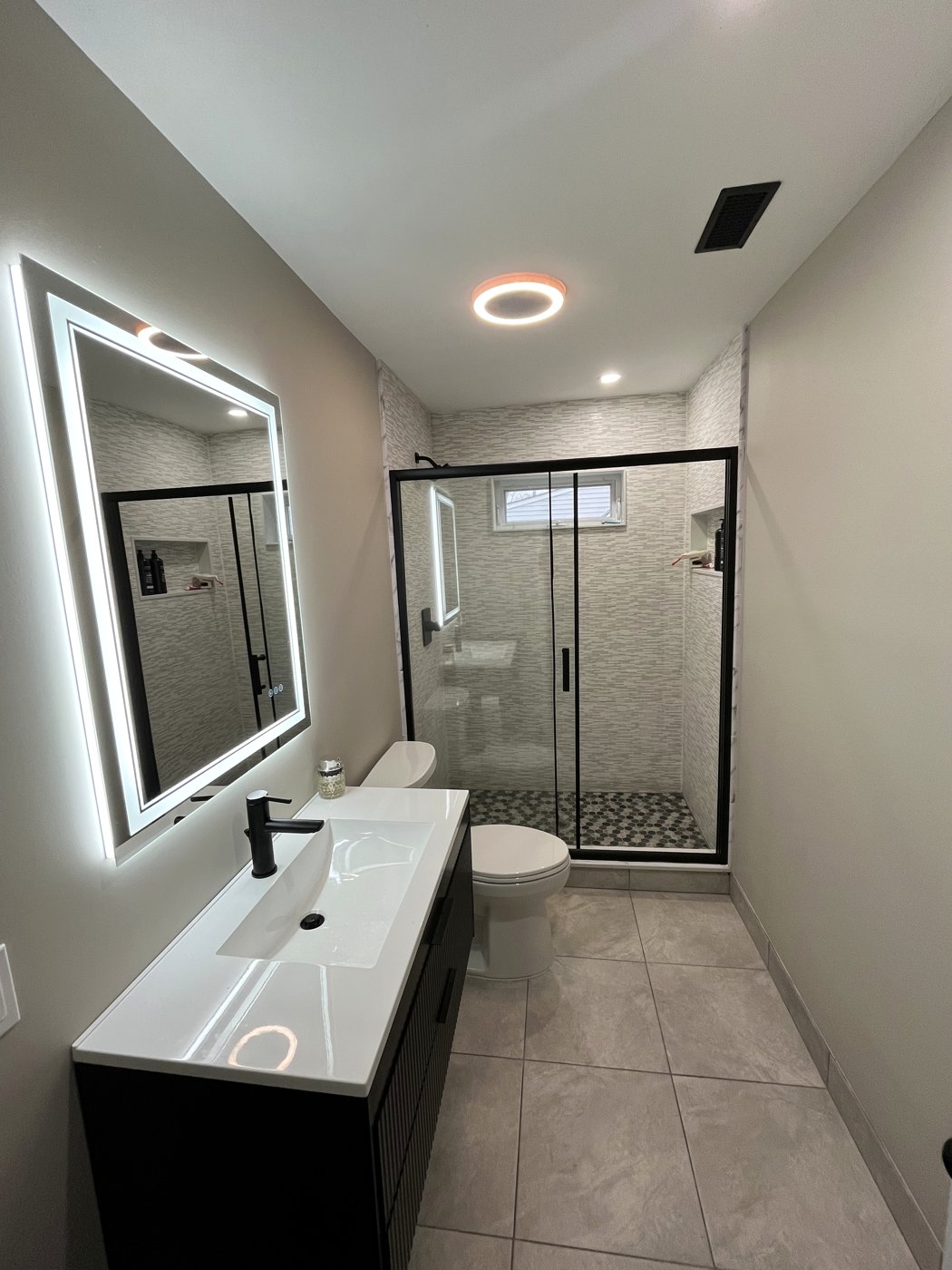 High-end bathroom remodel by E.M Construction